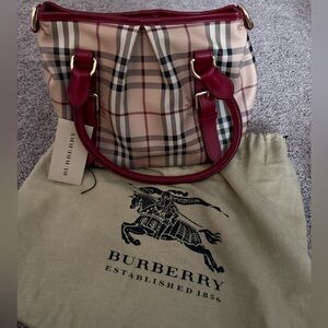 Burberry shoulder bag with military red handles.